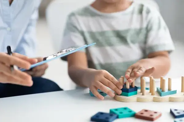 Boy playing happily in child therapy session